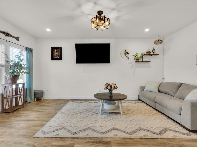 living room featuring recessed lighting, wood finished floors, and baseboards