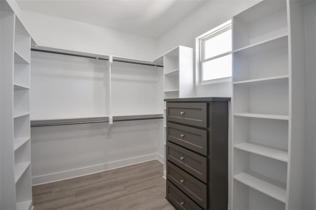 spacious closet with wood finished floors