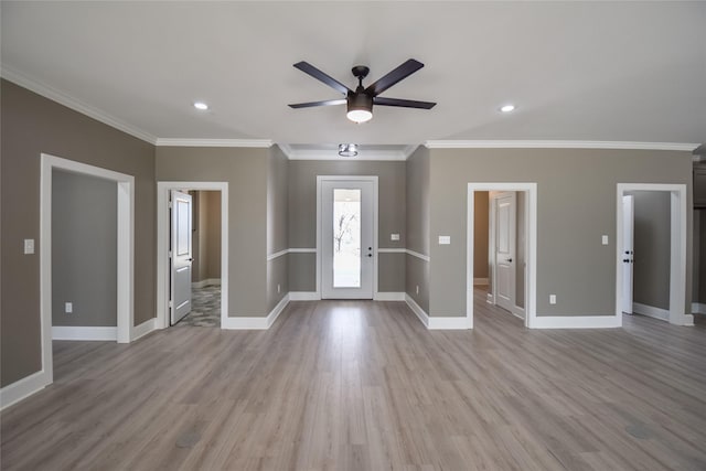 interior space with crown molding, baseboards, ceiling fan, recessed lighting, and light wood-style flooring