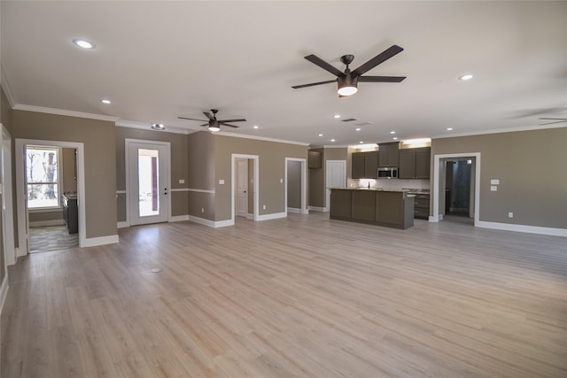 unfurnished living room with recessed lighting, light wood-style floors, baseboards, and ceiling fan