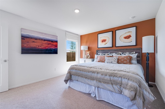 carpeted bedroom with baseboards