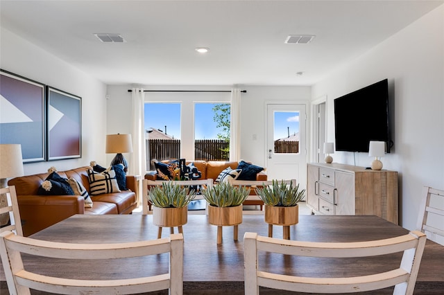 dining area featuring wood finished floors and visible vents