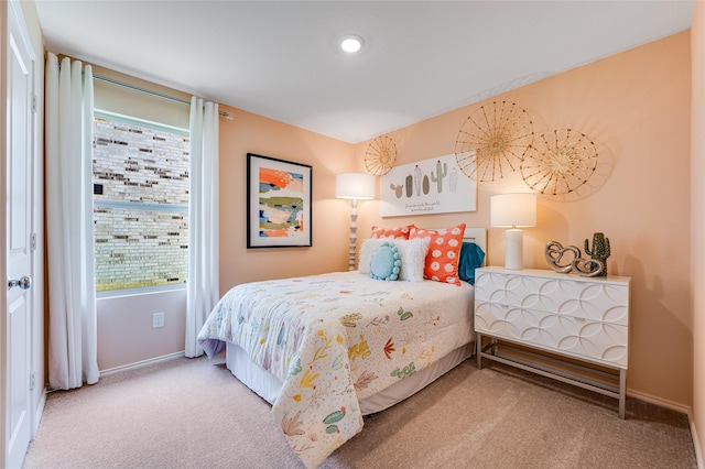 carpeted bedroom with baseboards