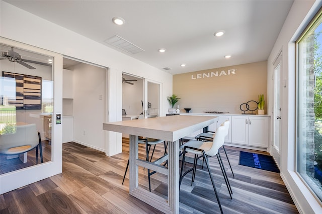 dining area with ceiling fan, visible vents, wood finished floors, and recessed lighting