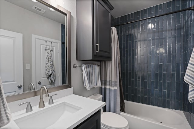 full bath with toilet, shower / tub combo, visible vents, and vanity