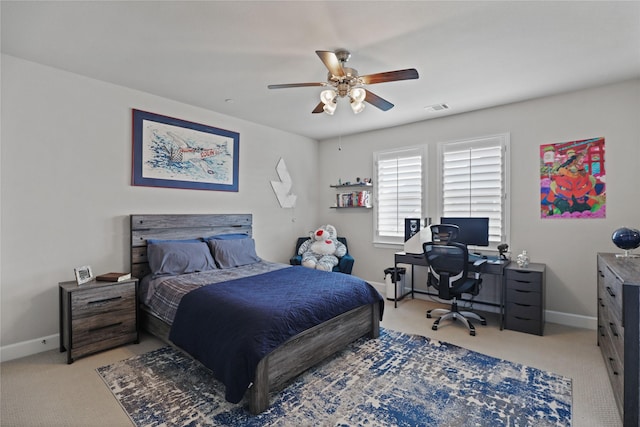 bedroom with carpet floors, visible vents, baseboards, and a ceiling fan