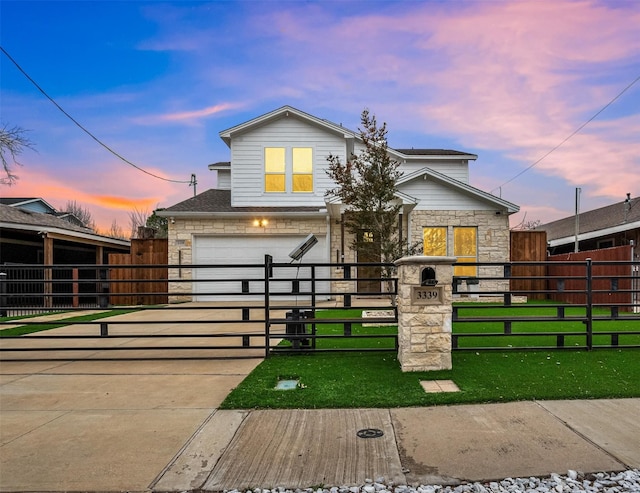 traditional-style house with a garage, stone siding, and a fenced front yard