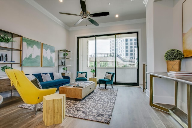 living room featuring ceiling fan, ornamental molding, wood finished floors, and recessed lighting