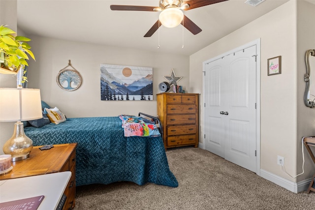 carpeted bedroom with ceiling fan, visible vents, and baseboards