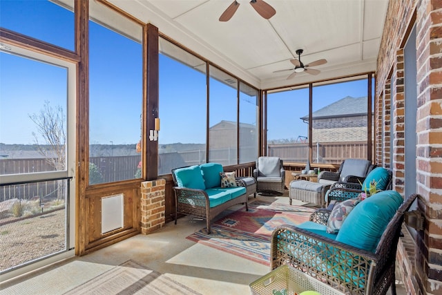 sunroom with a ceiling fan