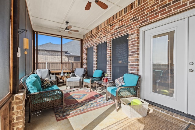 sunroom / solarium with a ceiling fan