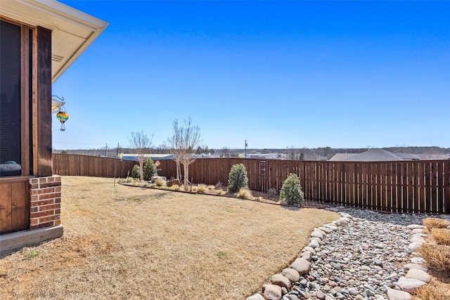 view of yard with a fenced backyard