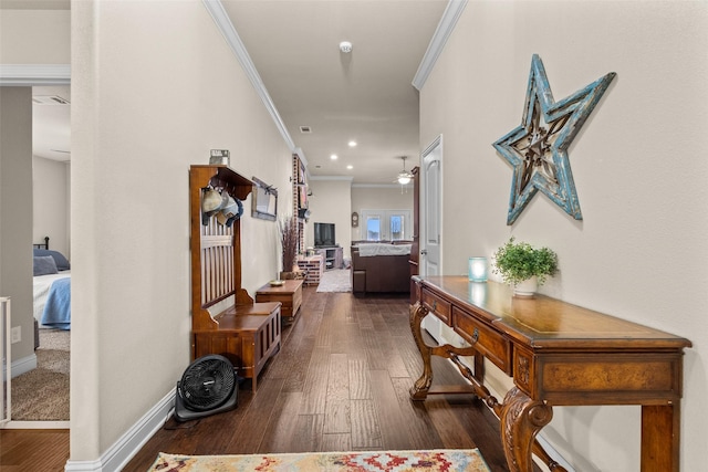 hallway featuring dark wood-style floors, baseboards, crown molding, and recessed lighting