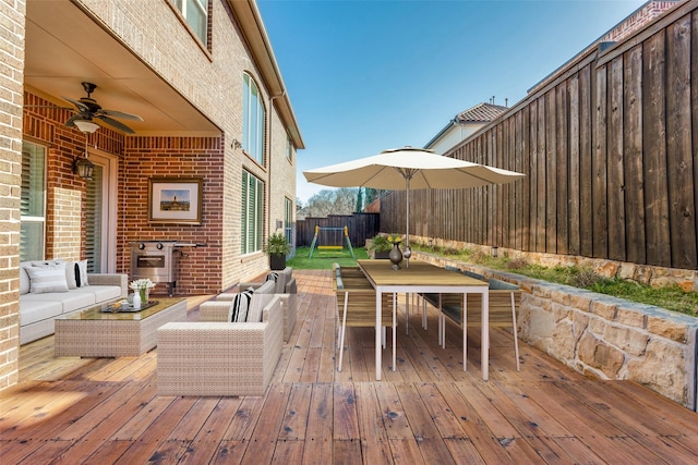 6005 Monte Cristo Ln, Plano, TX 75024 - wooden terrace with outdoor dining space, an outdoor living space, a ceiling fan, and a fenced backyard
