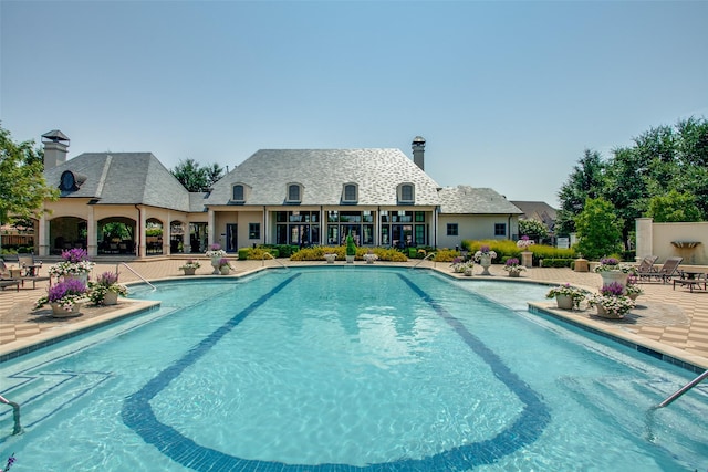6005 Monte Cristo Ln, Plano, TX 75024 - community pool with a patio area
