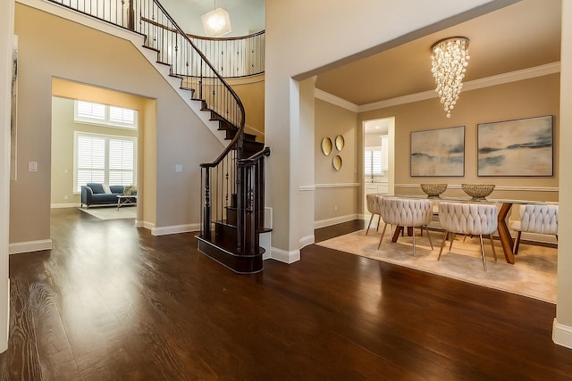 6005 Monte Cristo Ln, Plano, TX 75024 - foyer entrance with wood finished floors, stairway, a chandelier, crown molding, and a towering ceiling