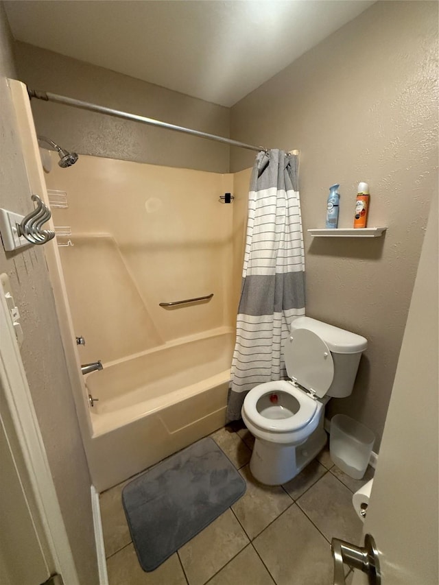 bathroom featuring toilet, shower / bathtub combination with curtain, and tile patterned floors