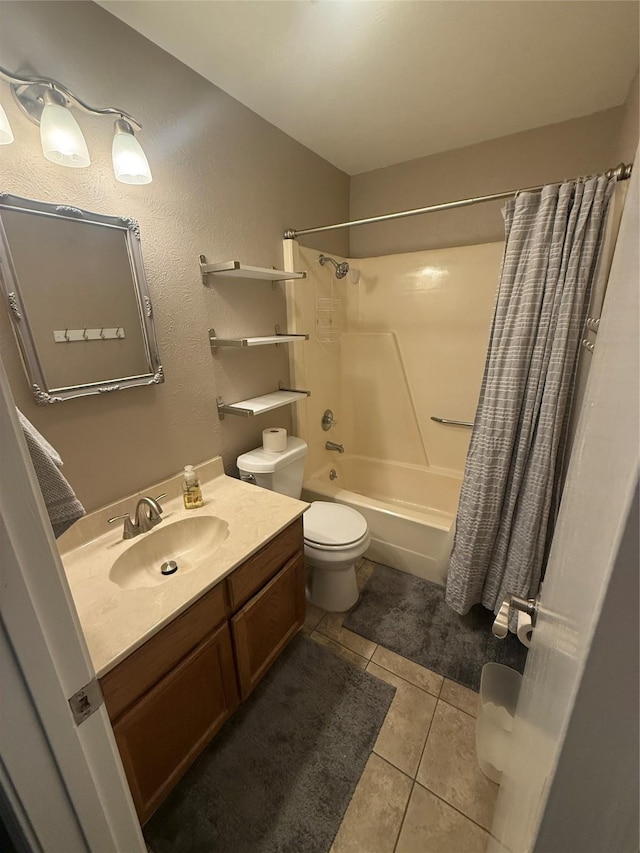 bathroom featuring toilet, shower / tub combo with curtain, vanity, and tile patterned floors