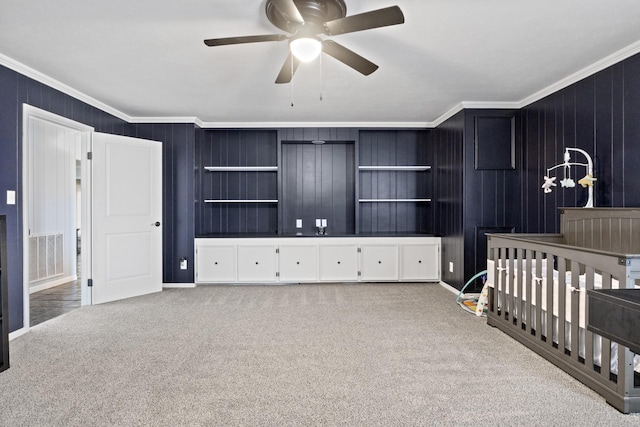 bedroom featuring ceiling fan, carpet floors, visible vents, and crown molding