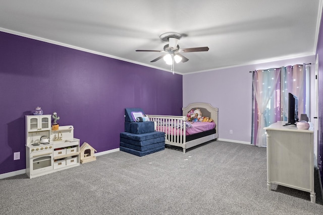 carpeted bedroom with ornamental molding, baseboards, and a ceiling fan