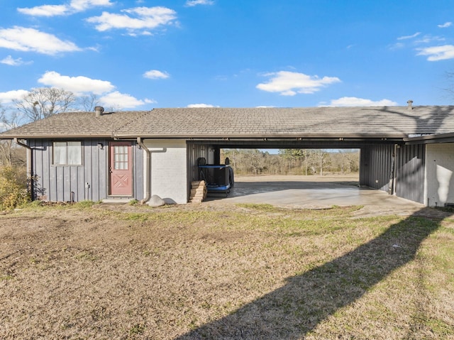 view of yard featuring an attached carport