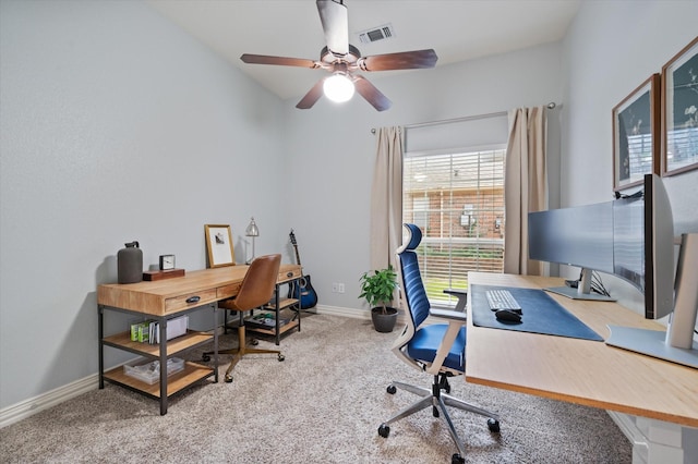 home office featuring carpet floors, a healthy amount of sunlight, visible vents, and baseboards