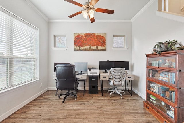 home office featuring a ceiling fan, baseboards, crown molding, and wood finished floors