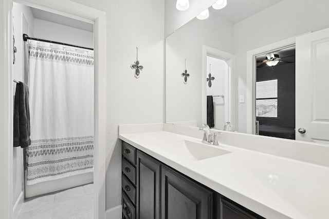 full bath featuring tile patterned flooring, vanity, and a shower with shower curtain