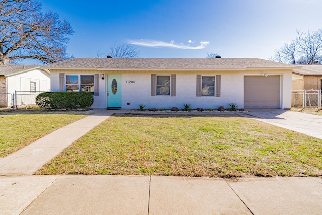 ranch-style house featuring concrete driveway, brick siding, fence, and a front lawn