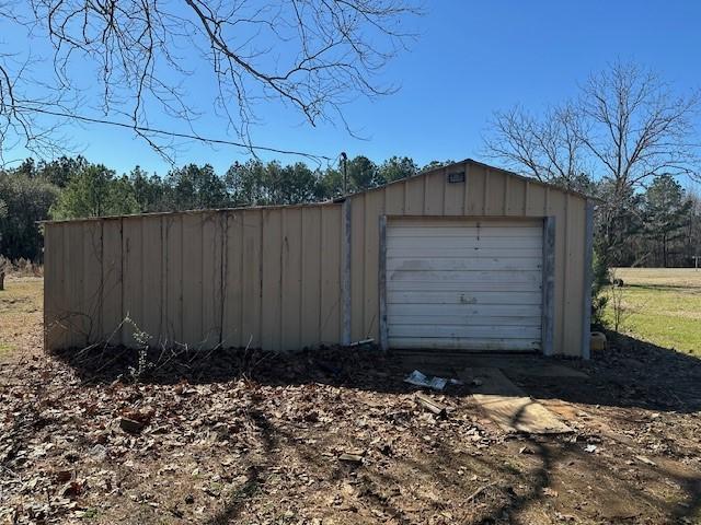 detached garage featuring driveway