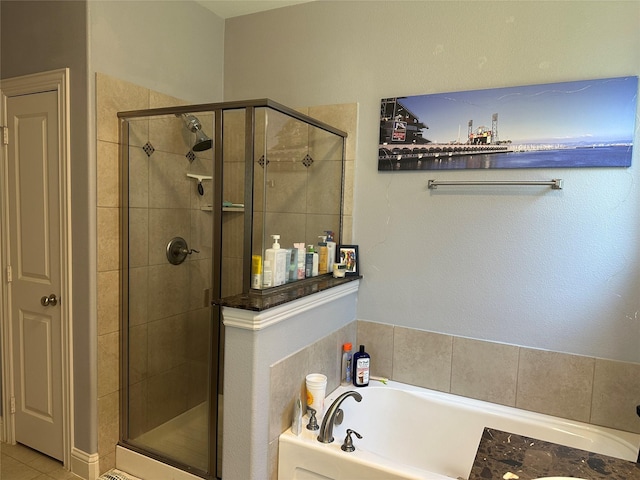 full bath featuring a stall shower and a garden tub