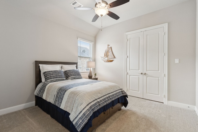 carpeted bedroom with baseboards, a closet, visible vents, and a ceiling fan