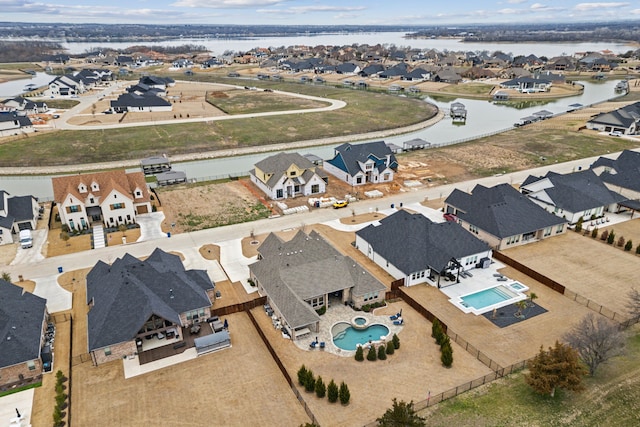 aerial view featuring a water view and a residential view