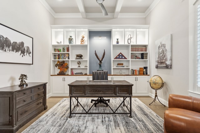 office area featuring beam ceiling, crown molding, light wood finished floors, and baseboards