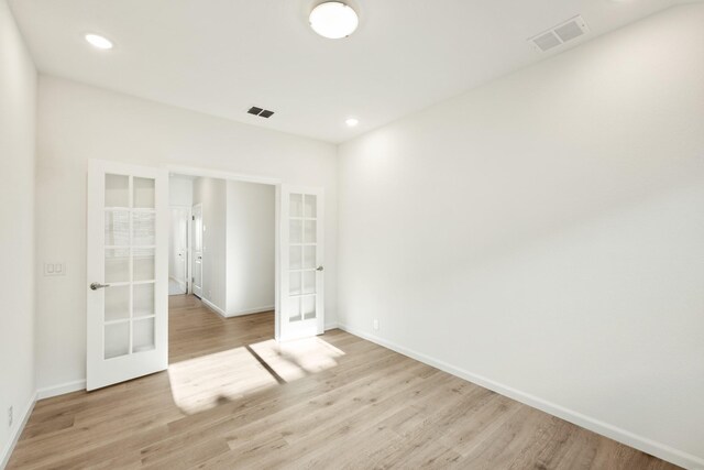 114 Winterwood Dr, Lavon, TX 75166 - unfurnished room featuring french doors, light wood-style flooring, baseboards, and recessed lighting