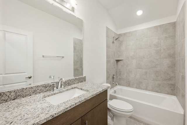 bathroom featuring toilet, recessed lighting, vanity, and bathing tub / shower combination