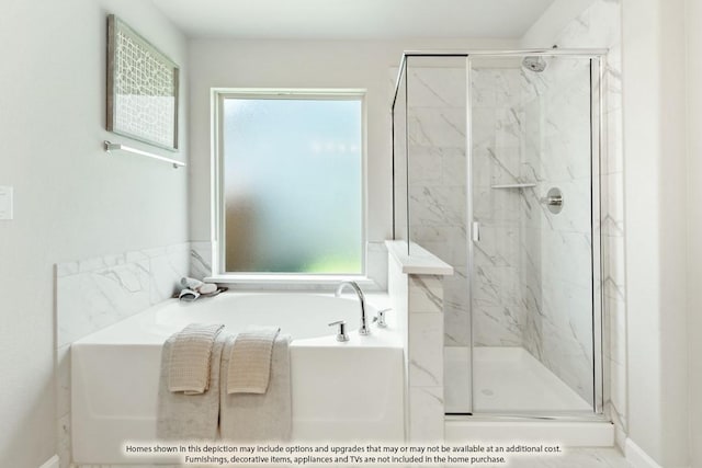 full bathroom featuring a garden tub and a marble finish shower