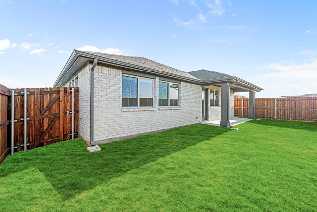 114 Winterwood Dr, Lavon, TX 75166 - rear view of house featuring brick siding, a patio, and a gate