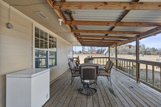 deck with outdoor dining space