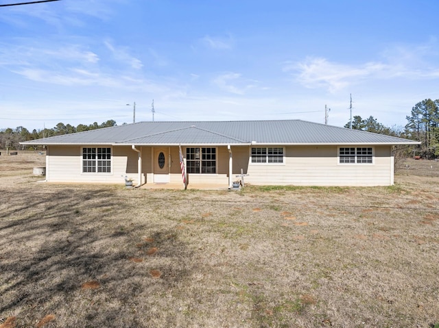 ranch-style house with metal roof