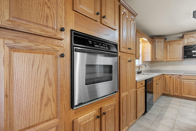 kitchen with arched walkways, light tile patterned flooring, a sink, light countertops, and black appliances