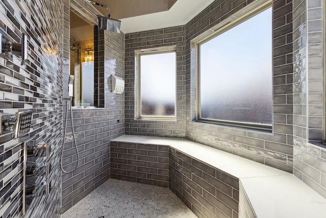 bathroom with tiled shower