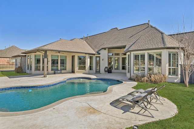 view of pool featuring a fenced in pool, a patio area, fence, and a ceiling fan