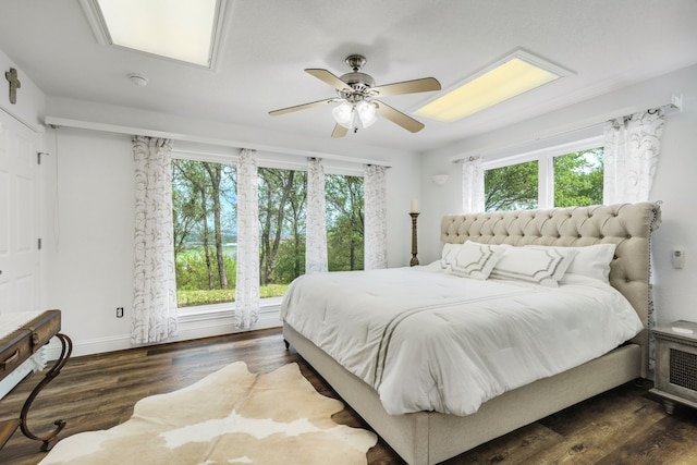 bedroom with a ceiling fan and wood finished floors