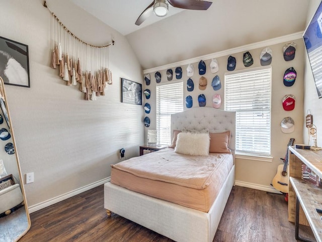 bedroom with lofted ceiling, ceiling fan, baseboards, and dark wood-type flooring