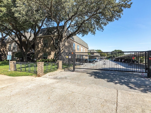 view of gate featuring fence