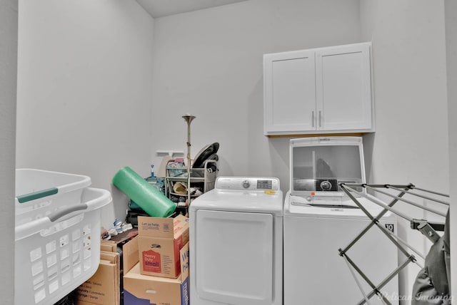 laundry room featuring cabinet space and washer and dryer