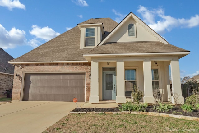 view of front of house featuring a porch, a garage, brick siding, a shingled roof, and driveway