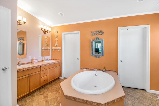 bathroom featuring a garden tub, double vanity, ornamental molding, stone finish floor, and a sink