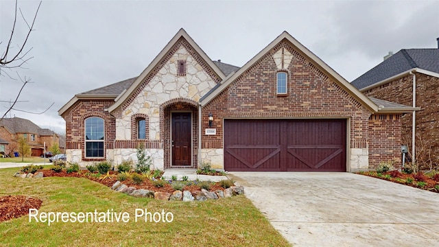 view of front of property with a garage, stone siding, concrete driveway, and brick siding